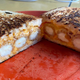 Grilled cheese with mozzarella sticks in it.